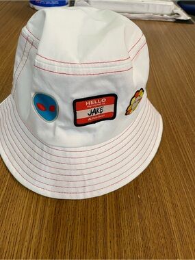 White State Farm Bucket Hat with Red Stitching and Playful Patch Details